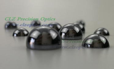 Aspheric lenses for terahertz imaging