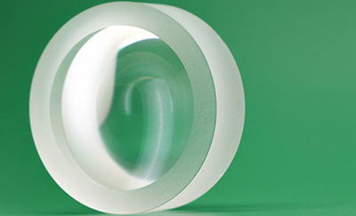 What Is It About an Achromatic Lens That Makes the Image Clearer?